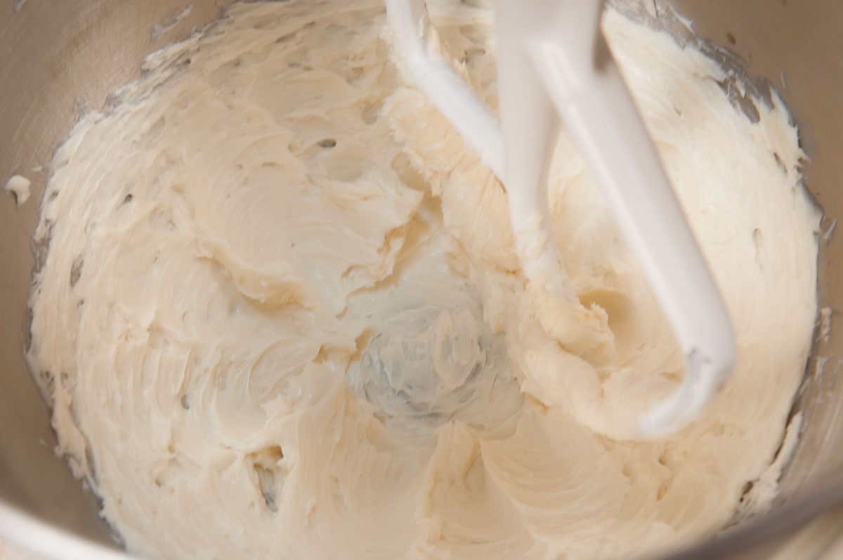The butter and vanilla in the mixing bowl has been creamed until light.