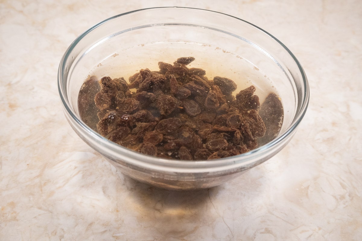 The raisins are soaking in very hot water to plump them up.
