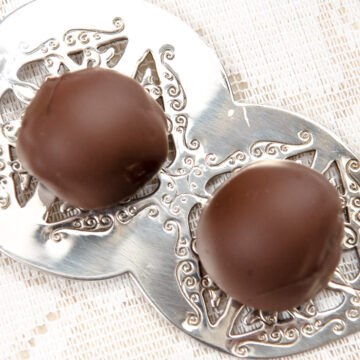 Two Chocolate Trufles on a silver server.