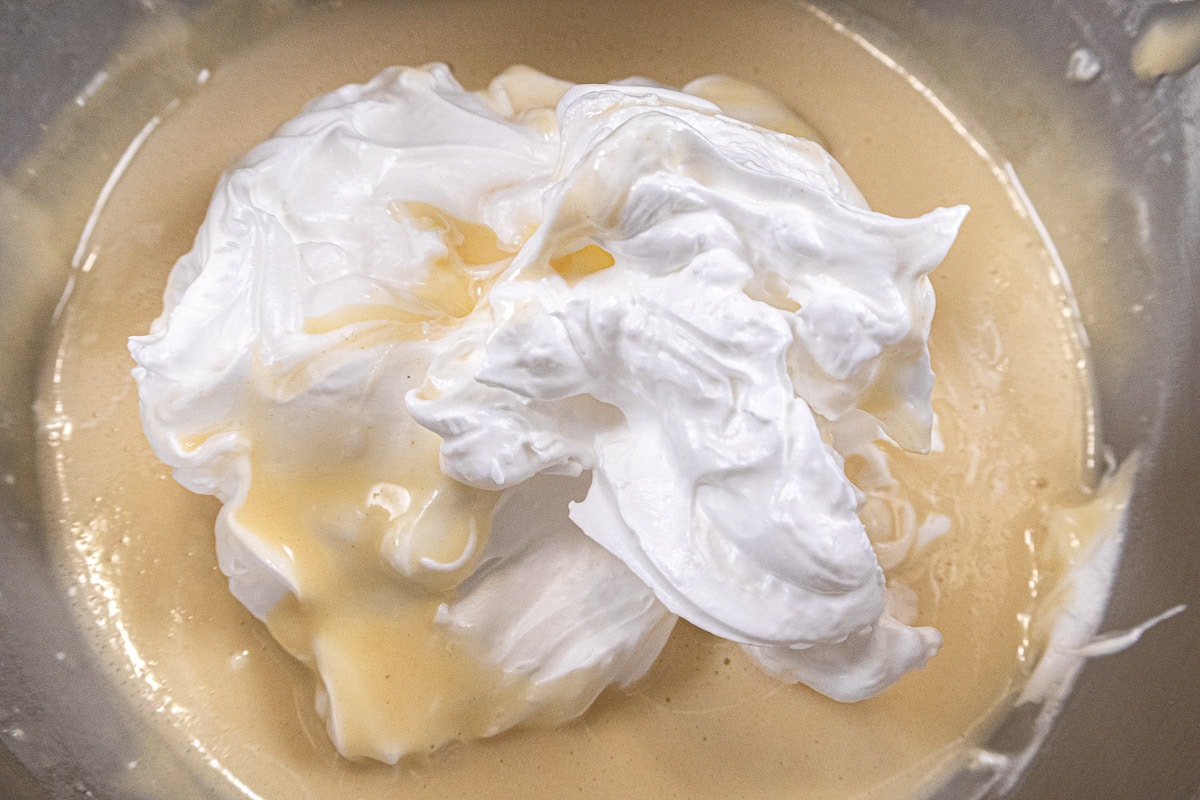 About ¼ of the beaten egg whites are added to the batter.