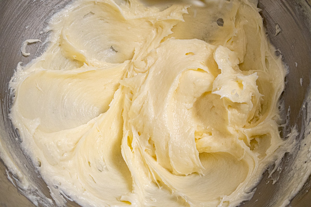 The butter, cream cheese and sugar are creamed in the mixing bowl.