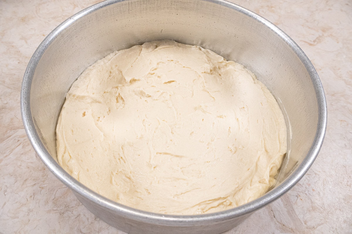 Half of the batter is spread in the bottom of the pan.