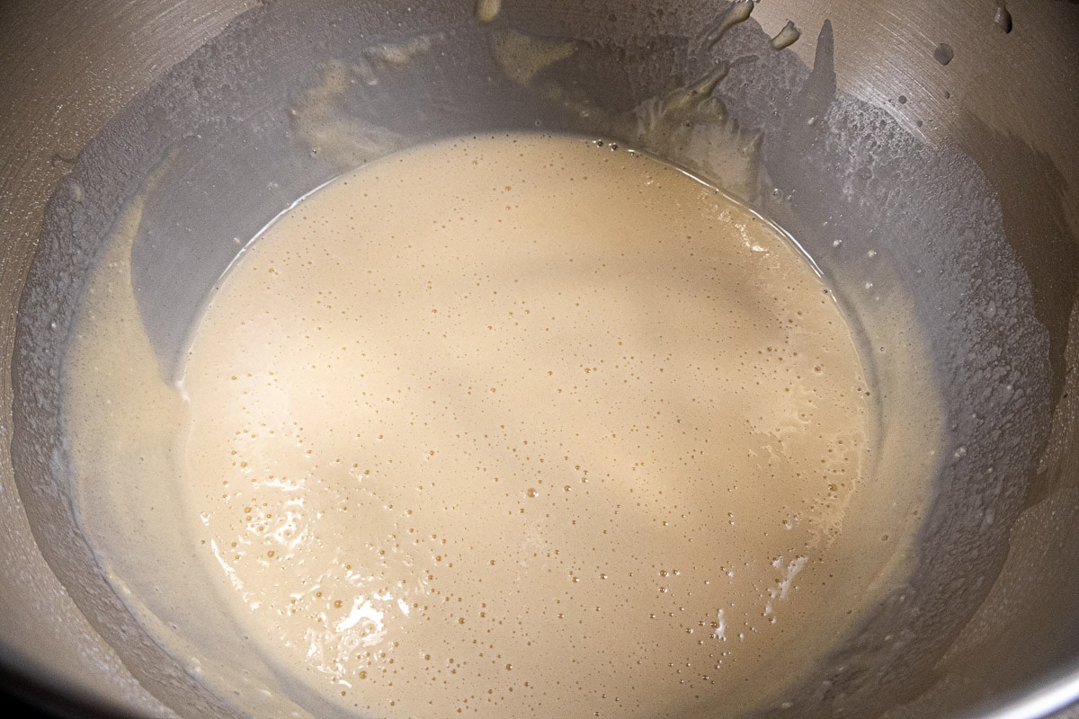The batter becomes very liquid after the addition of the water.