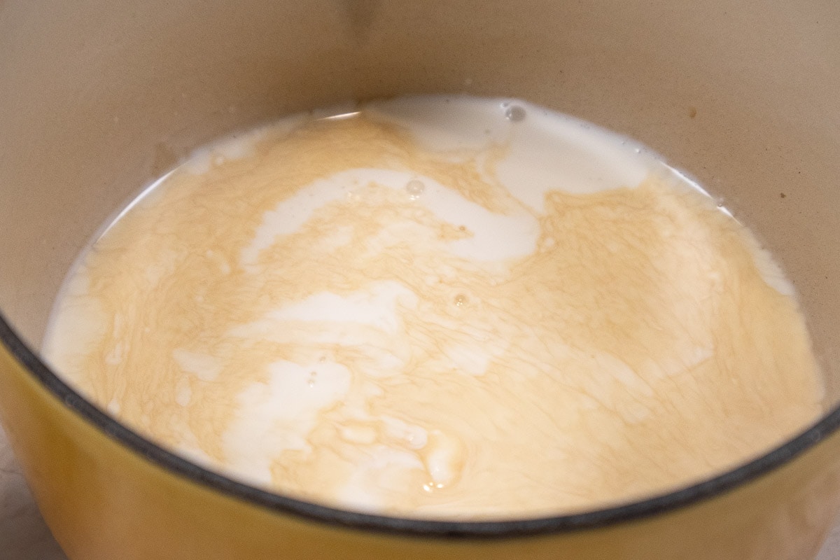 The heavy cream and Bailey's liqueur are placed in a small saucepan.