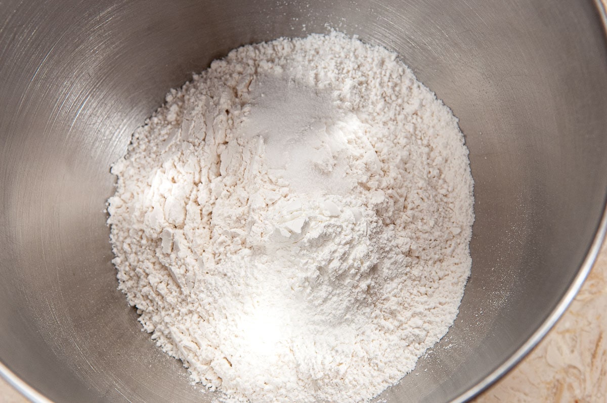 Flour, salt and baking powder are placed in a mixing bowl.