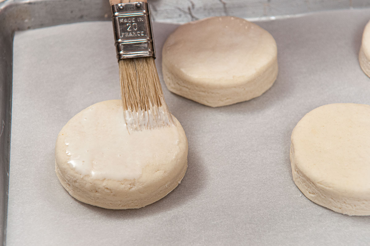 The biscuits are brushed with cream just before baking.