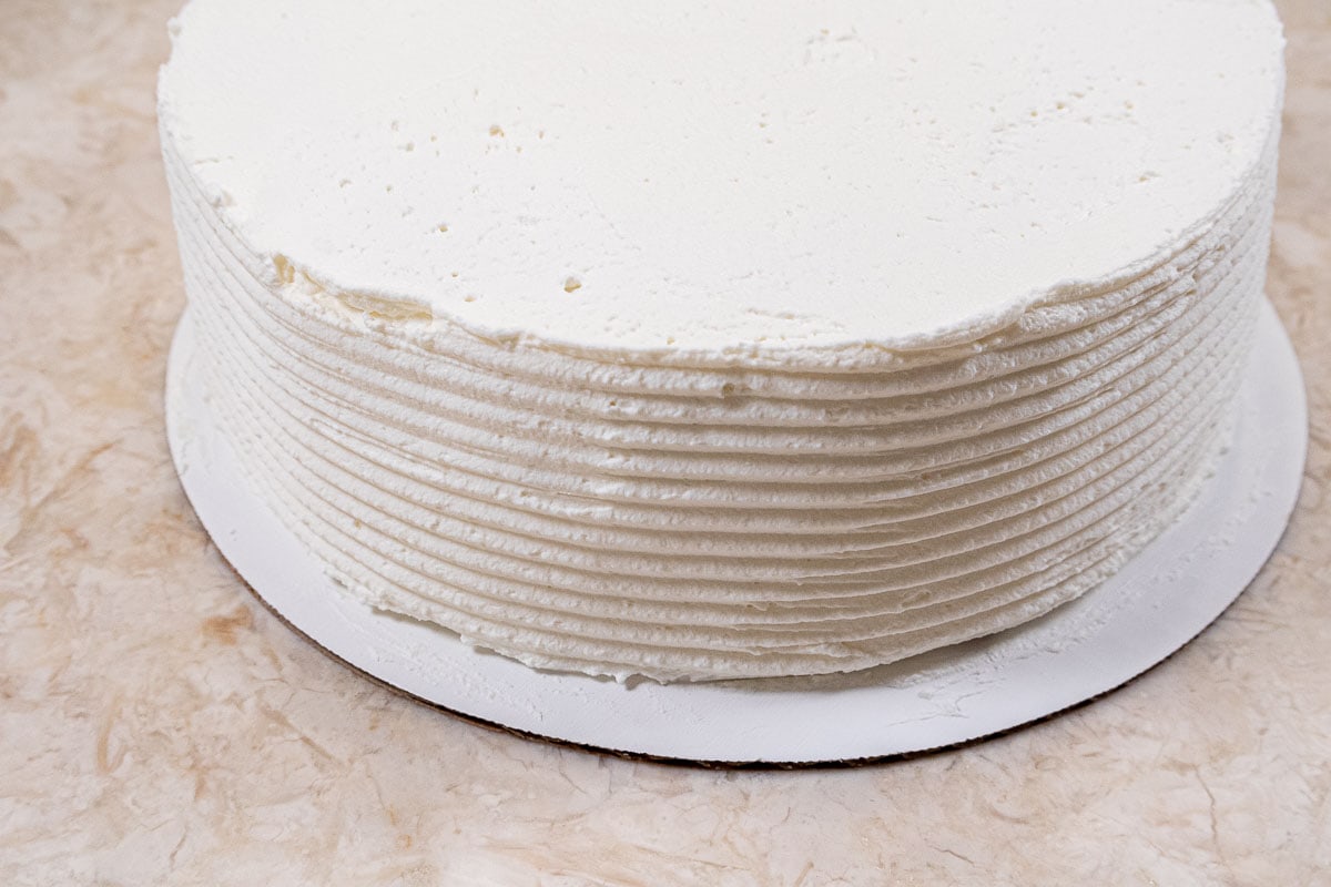 The wide side of the cake comb is used to make ridges on the side of the cake.