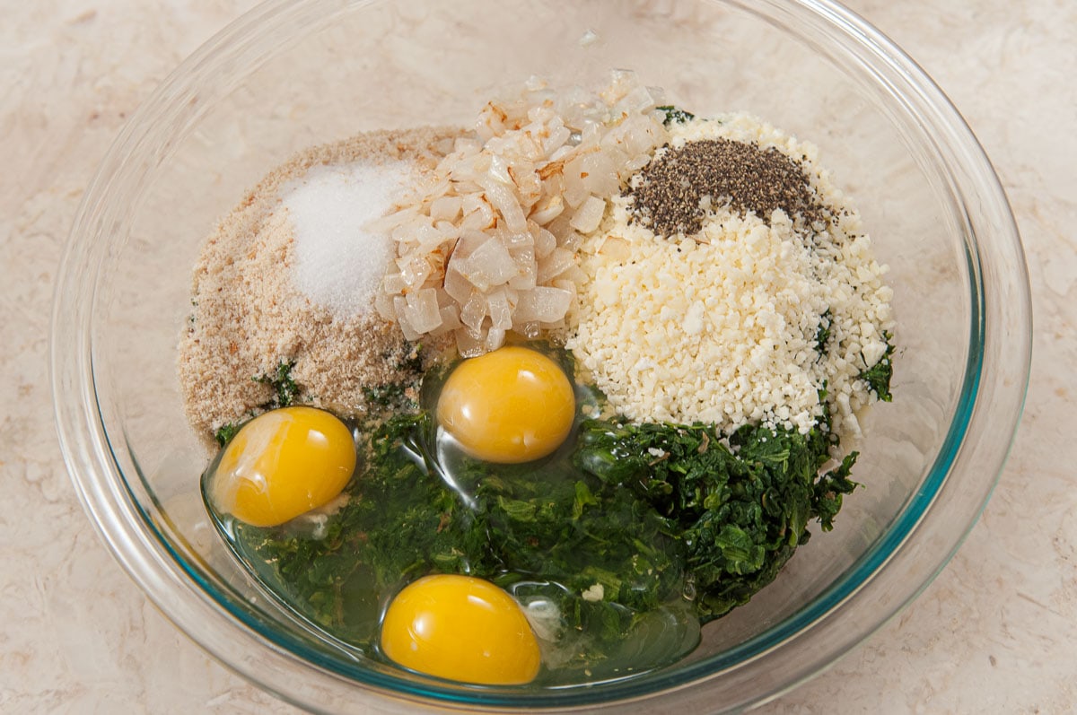 The remaining filling ingredients are placed in a bowl with the spinach.