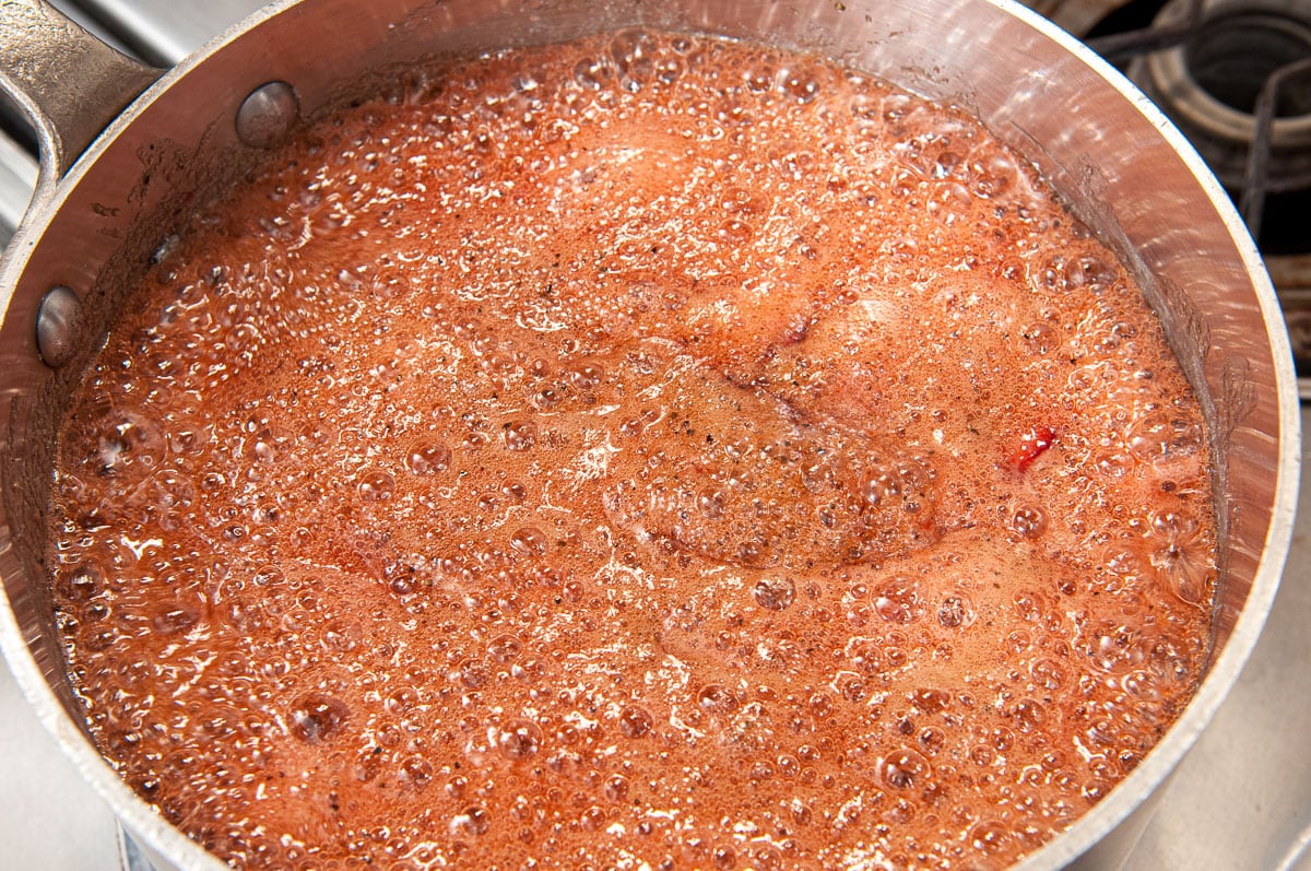 The ingredients are brought to a hard boil with foam on top.
