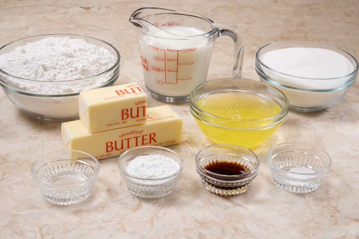 Ingredients for the White Cake are flour, milk, sugar, butter, egg whites, salt, baking powder, vanilla and almond extracts.