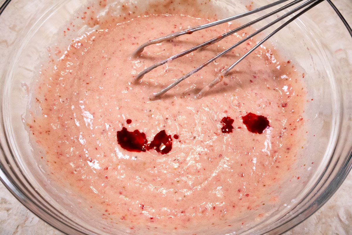 Red food coloring is added to the batter to pick up the color.