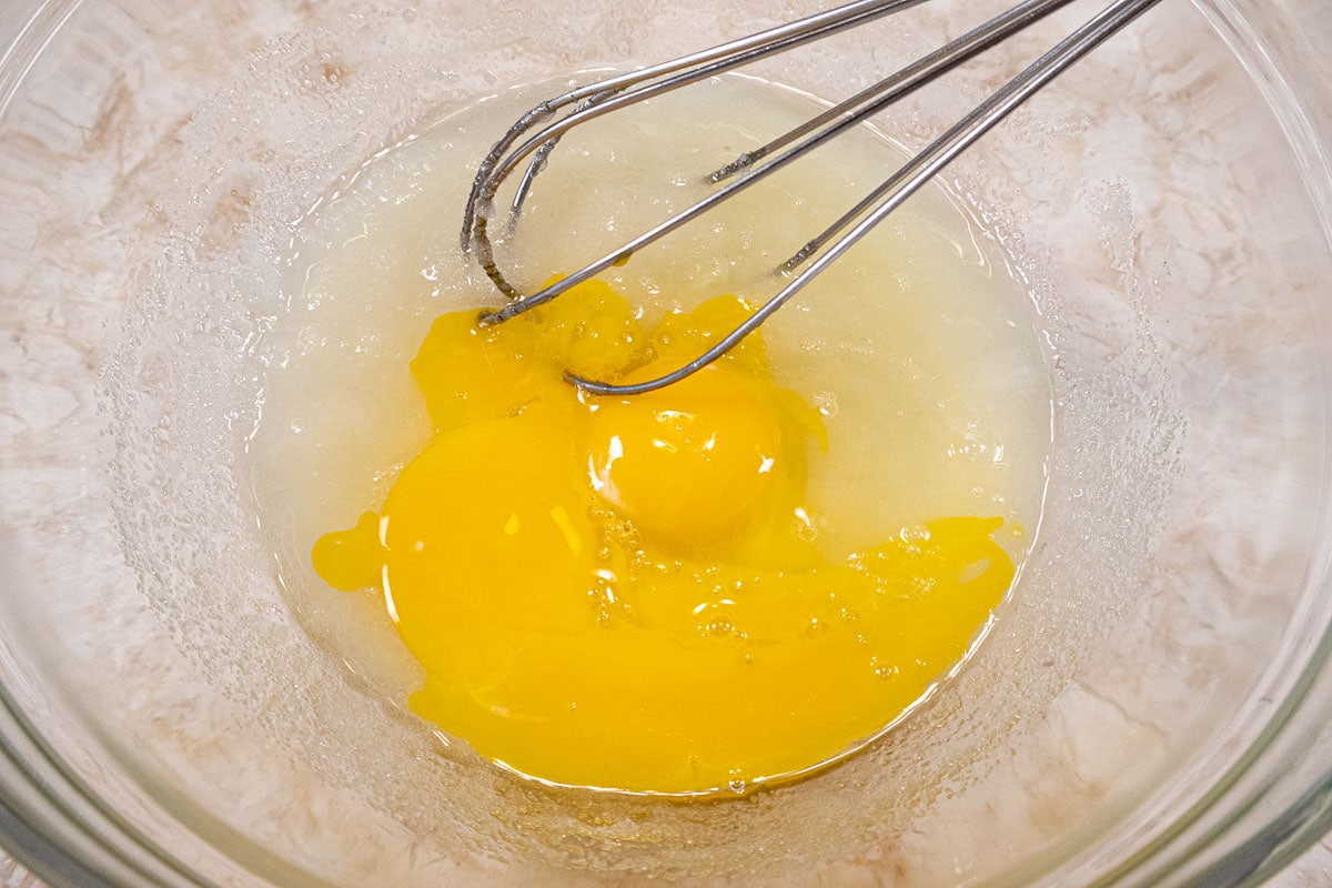 The egg and yolk are added to the oil mixture
