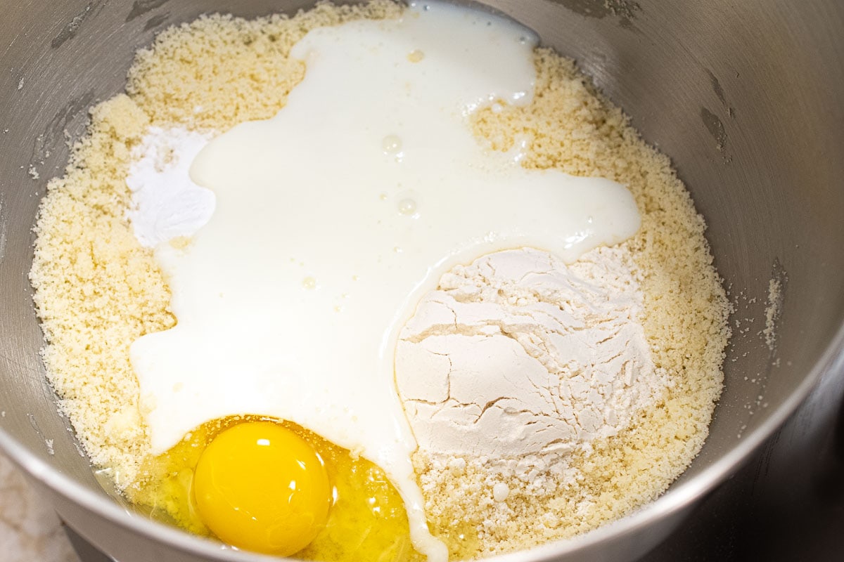 The buttermilk, egg, and remaining ¼ cup of flour are added to the crumbs in the mixing bowl.