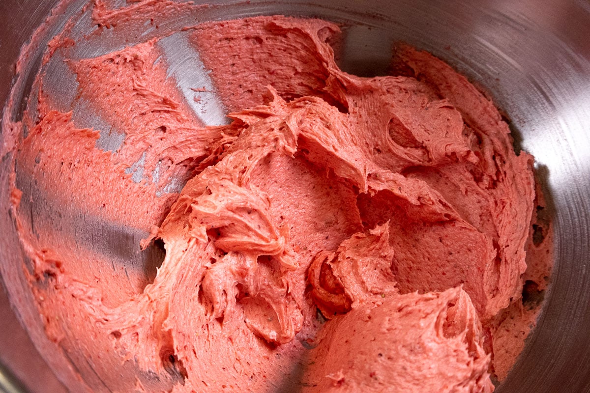 The strawberry buttercream is completely mixed.