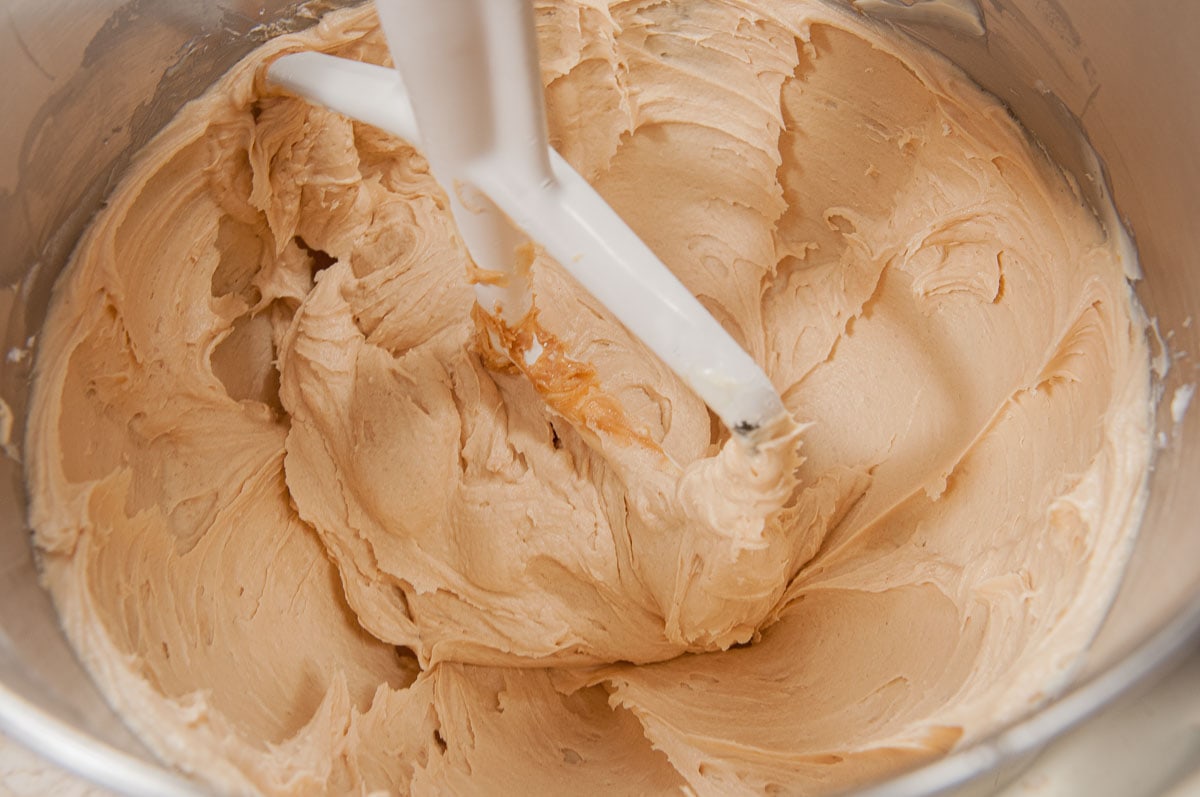 The peanut butter mousse ingredients have been whipped until light in texture and color.