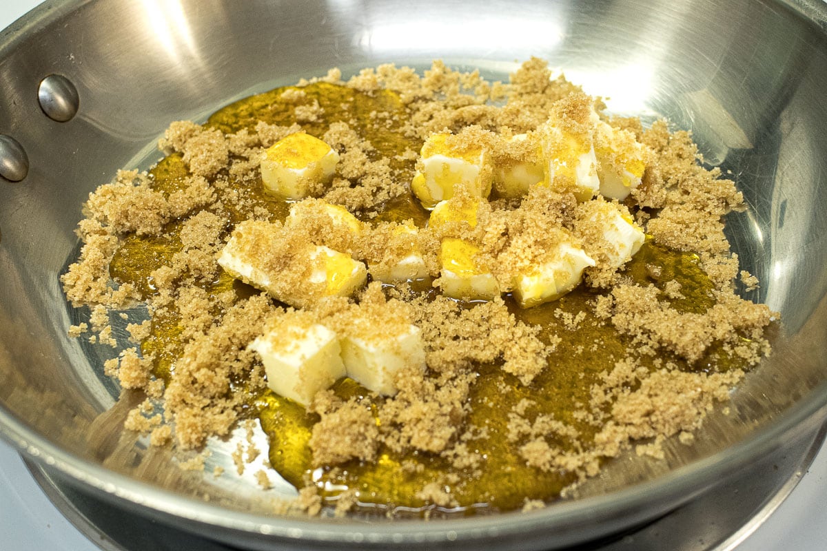 The butter, golden or corn syrup and brown sugar are in a saute pan.