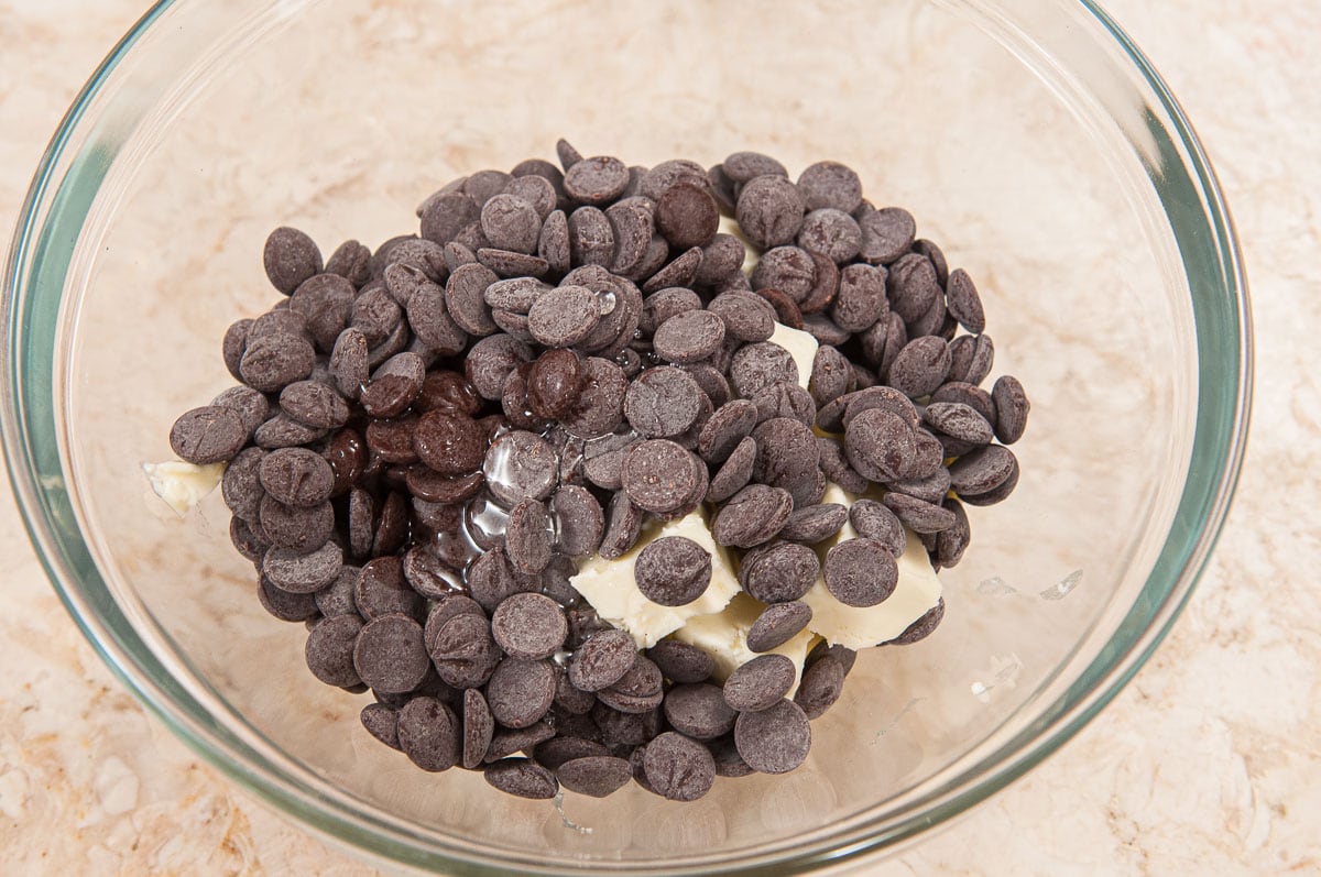 The butter and chocolate are placed in bowl to be melted either in the microwave or in a double boiler.