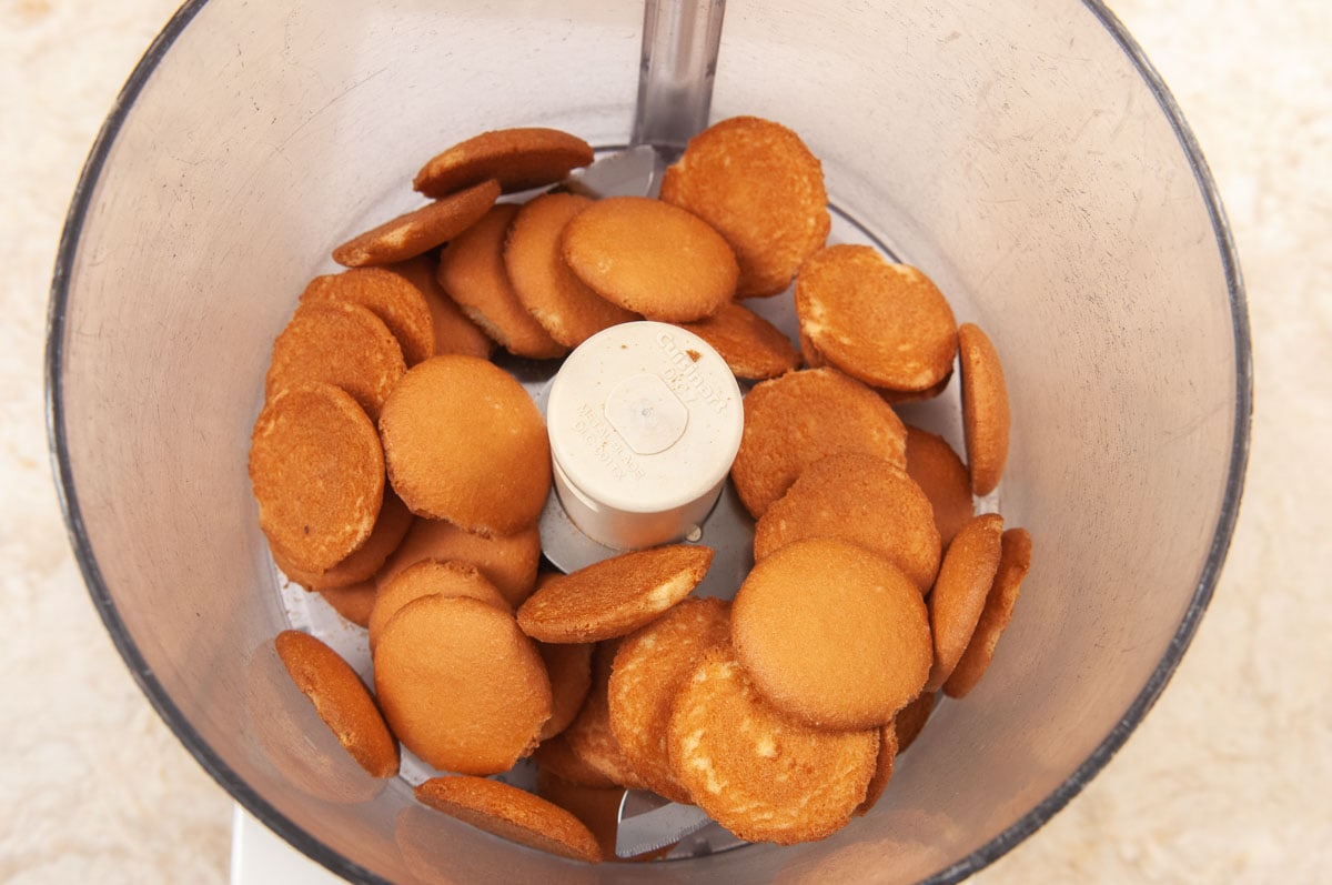 The vanilla wafers are in the bowl of a food processor,