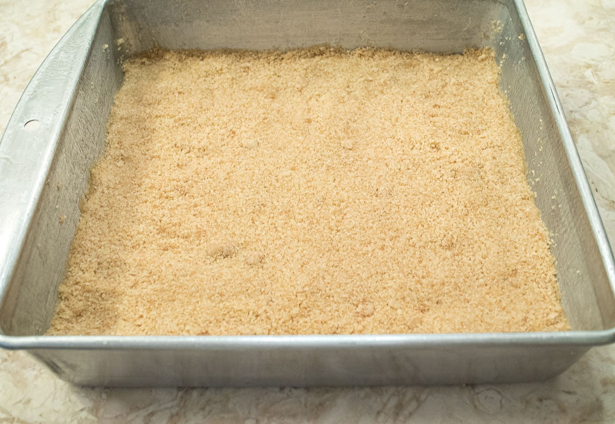 Two and a half cups of crumbs are pressed into the bottom of the pan for the base. 