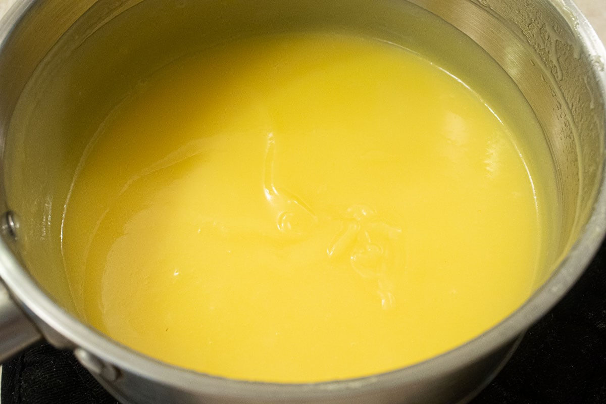 The finished curd, smooth and yellow  in the pan.