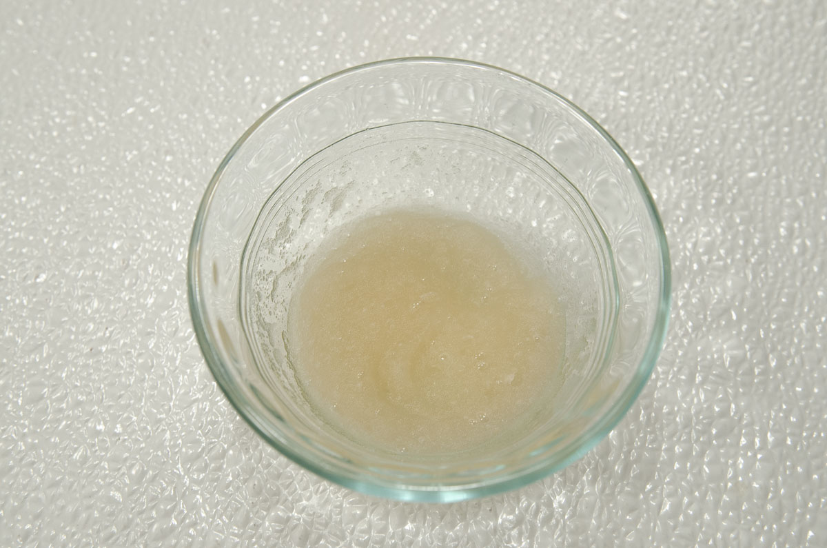 The water has been absorbed by the gelatin and is a solid mass.