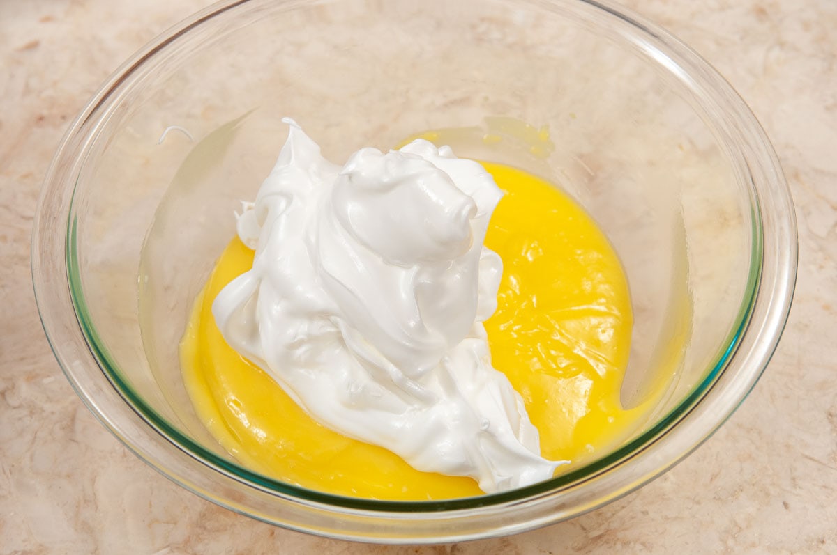 The meringue is added to the lemon curd.