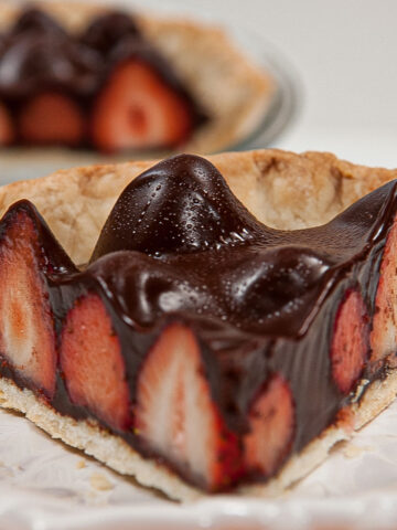 A slice of the Chocolate Strawberry Pie on a white plate.