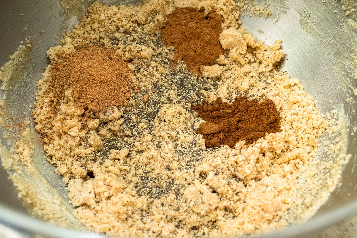The spices are added to the remaining crumbs in the mixing bowl.