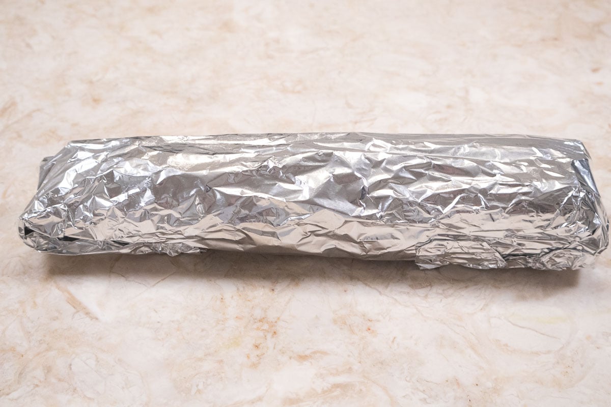 The celery has been wrapped tightly in foil.