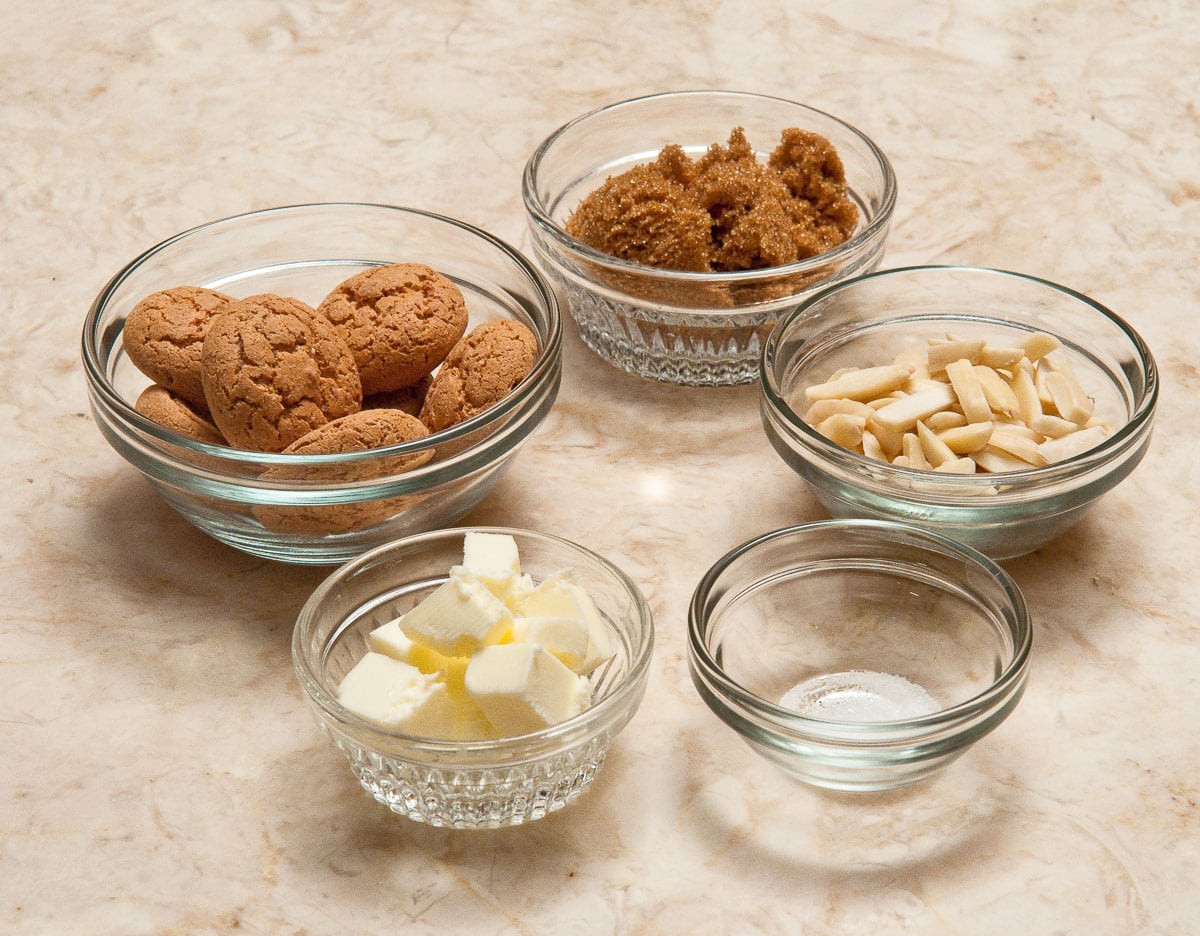 The ingredients for the amaretti crumble are amaretti cookies, brown sugar, almonds butter and salt.