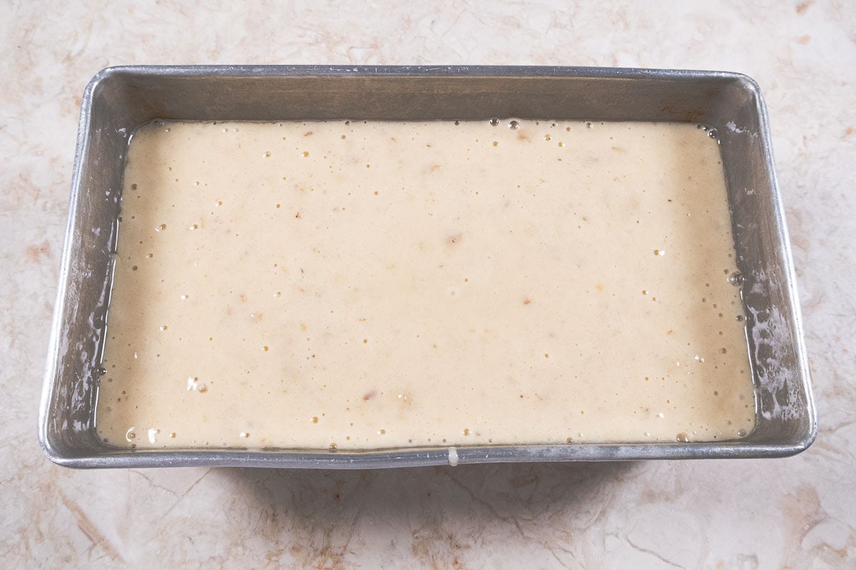 The batter is poured into a prepared pan.