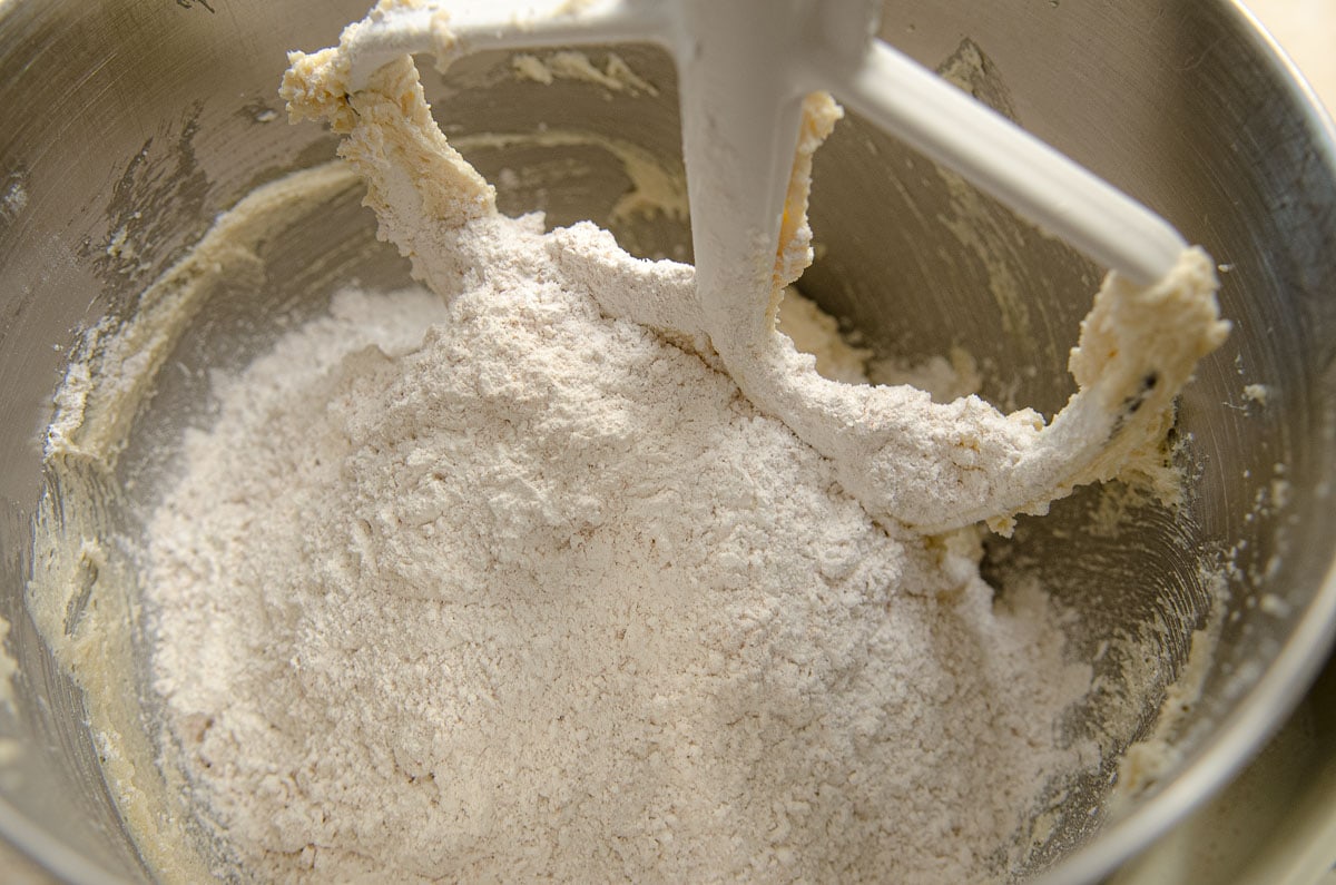 The flour is added to the mixing bowl.
