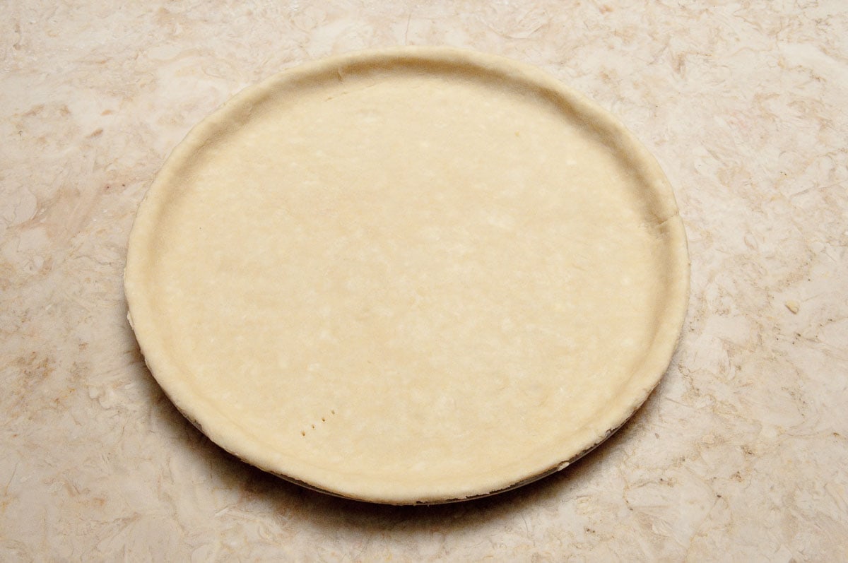 The crust is completed in the pan.