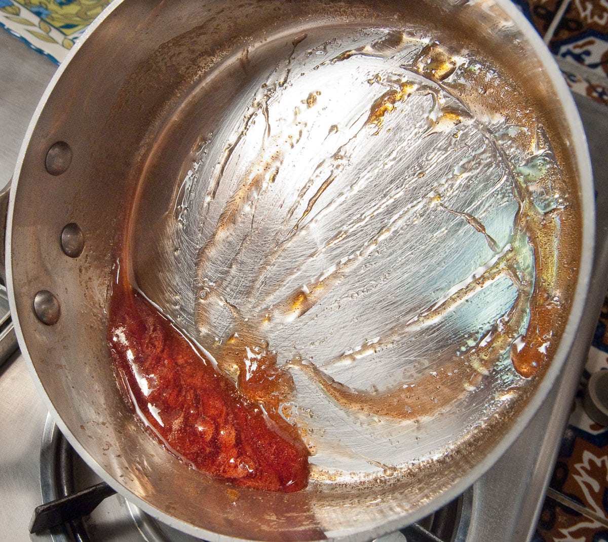 The syrup has been reduced to a thick jelly like mixture.
