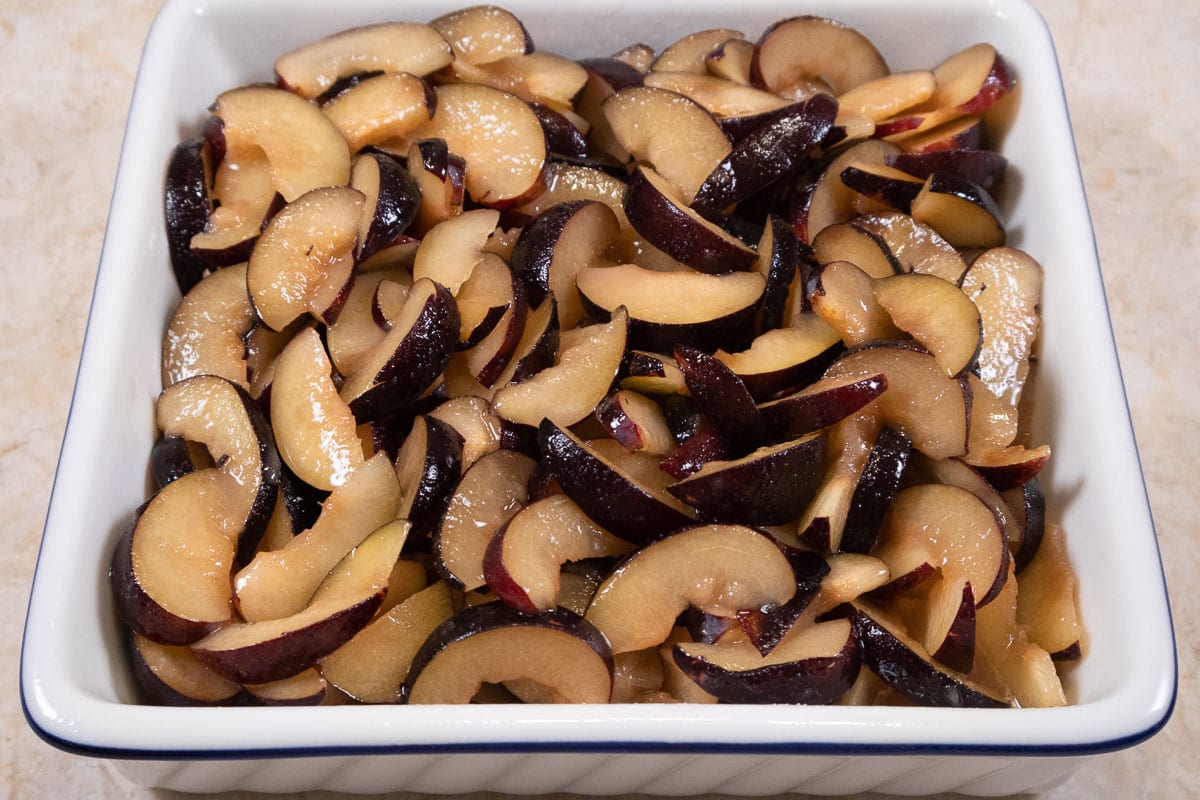 The plum mixture is poured into a baking dish.