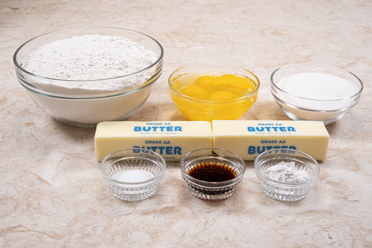 The ingredients for th e dough are flour, eggs, sugar, butter, baking powder, salt and vanilla.