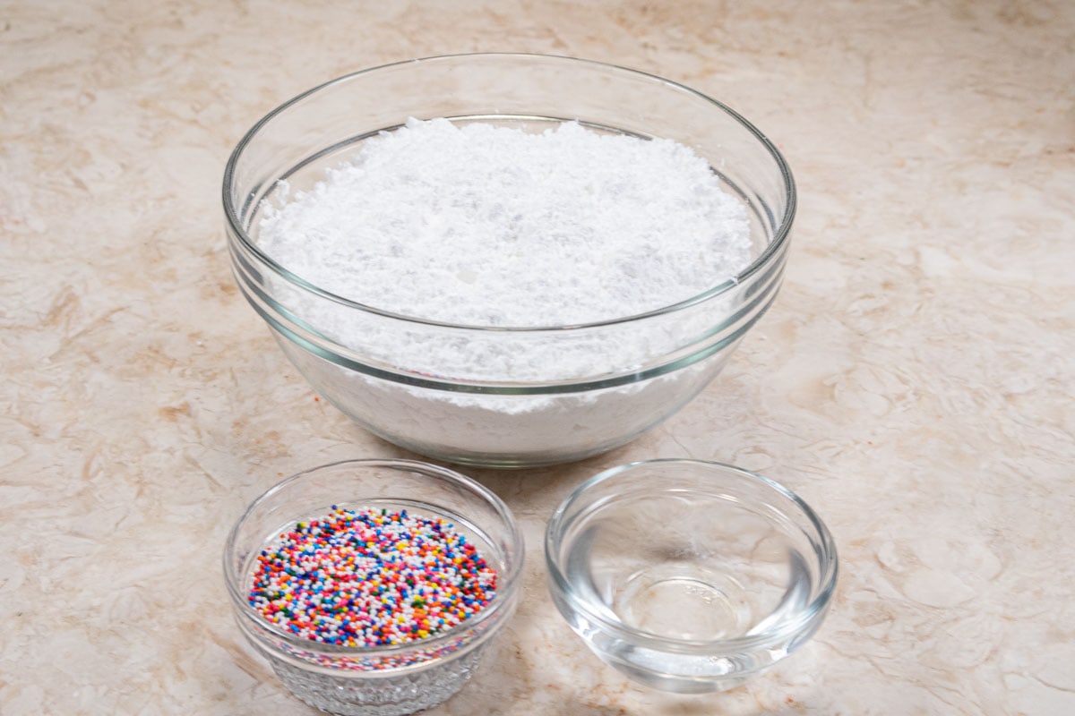 The ingredients for the icing are powdered sugar, water and nonpareils.