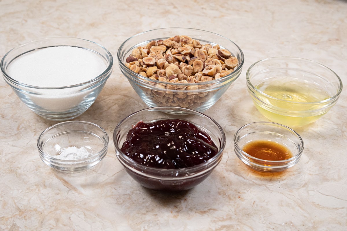 Ingredients for the Haselnussmakronen are sugar, hazelnuts, egg whites, cream of tarter, raspberry jam and vanilla.