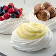 3 Delicate white Meringue shells filled with Lemon curd, fresh fruit and chocolate ice cream.