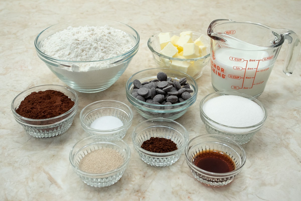 The ingredients for the chocolate yeast dough include bread flour, sugar, cocoa, salt,milk, unsalted butter,semisweet chocolate,instant coffee, instant yeast, and vanilla extract.