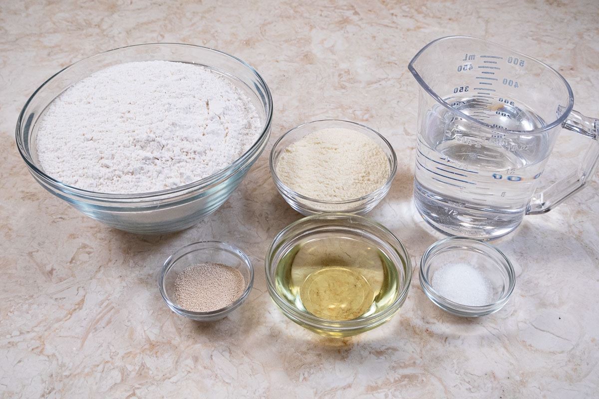 Ingredients for the Homemade Pizza Crust are all-purpose  flour, semolina flour, water,  yeast, oil and salt.
