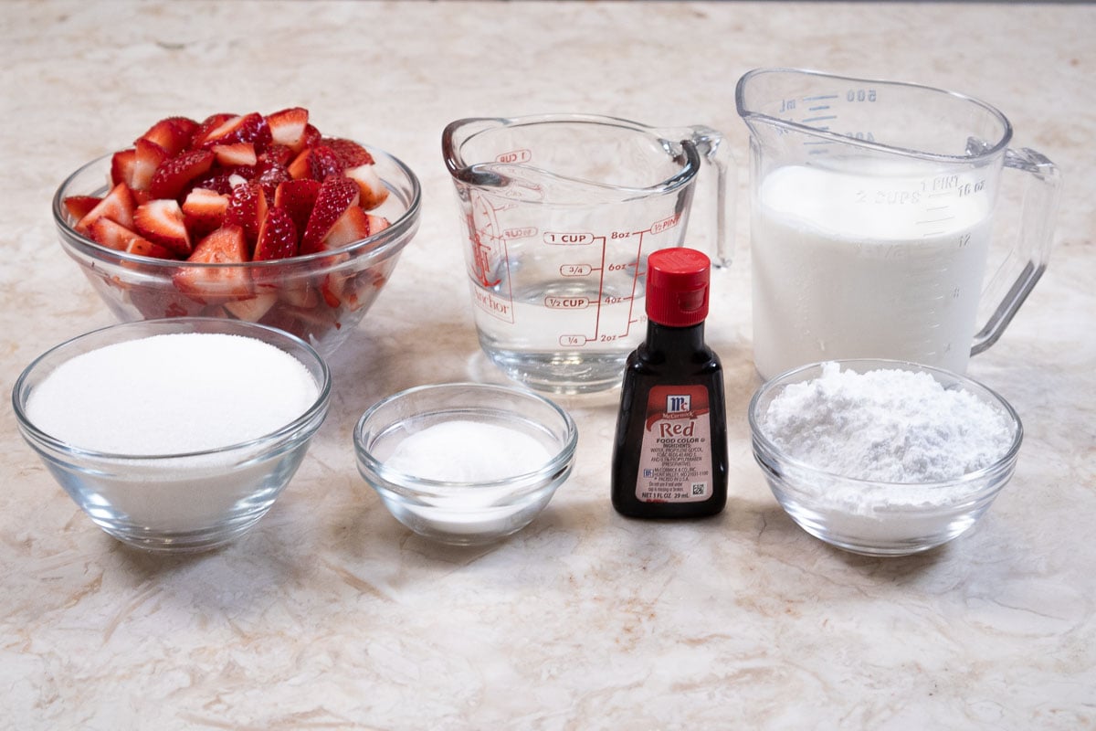 Ingredients to finish the cake include, fresh strawberries, water, heav cream, sugar, instant clear jel, food coloring and powdered sugar.