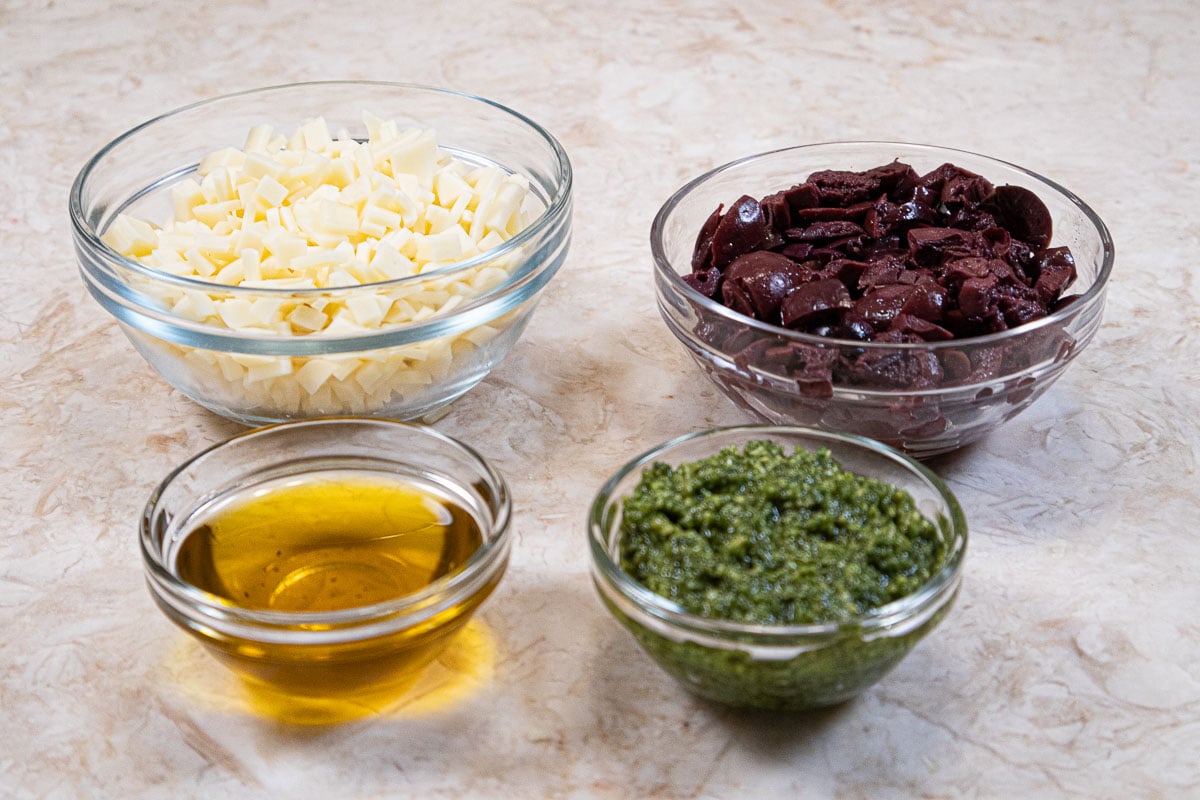 The filling for Pane Bianco includes, provolone cheese, calamata olives, pesto, zippy olive oil