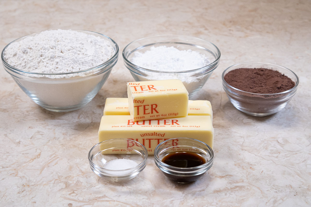 The ingredients for the chocolate cookies are flour, cocoa, powered sugar, unsalted butter salt and vanilla extract.