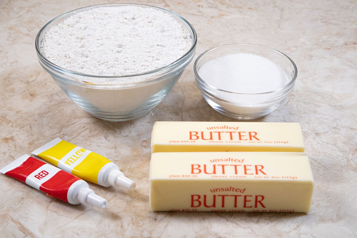 Ingredients for the Orange Dough are all-purpose flour, granulated sugar, red and yellow gel colors, and unsalted butter.