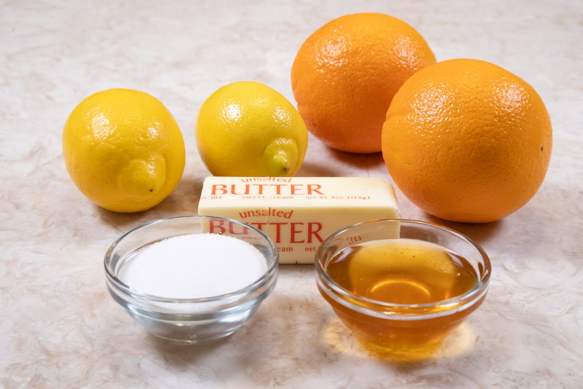 The ingredients for the Honey Orange Soaking Syrup include orange juice, lemon juice, unsalted butter, granulated sugar and honey.