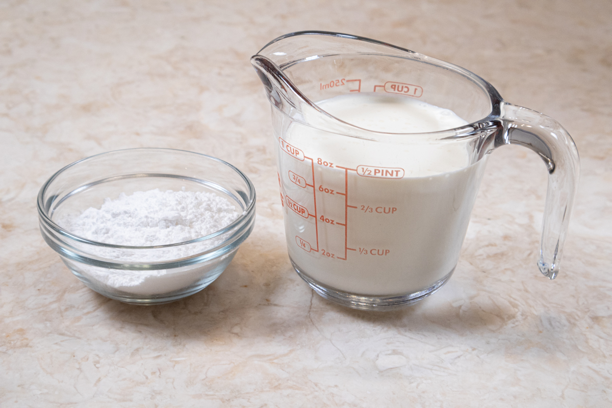 The whipped cream wreath on top of the pie uses heavy cream and powdered sugar.