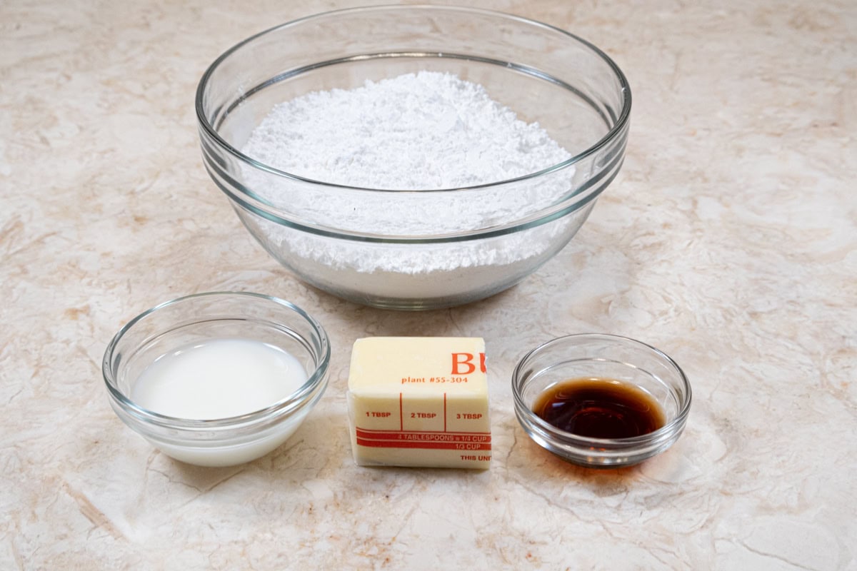 Ingredients for the icing are powdered sugar, butter, vanilla and milk