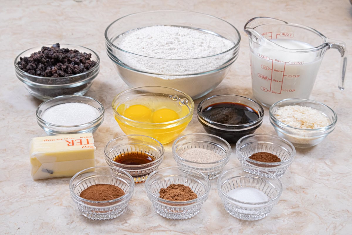 Ingredients for the Hot Cross Buns include currants, milk, unsalted butter, molasses, granulated sugar, instant mashed potatoes, eggs, vanilla, bread flour, instant yeast, salt, cinnamon, cloves, nutmeg. 