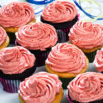 Cupcakes are finished with a swirl of Strawberry Buttercream.